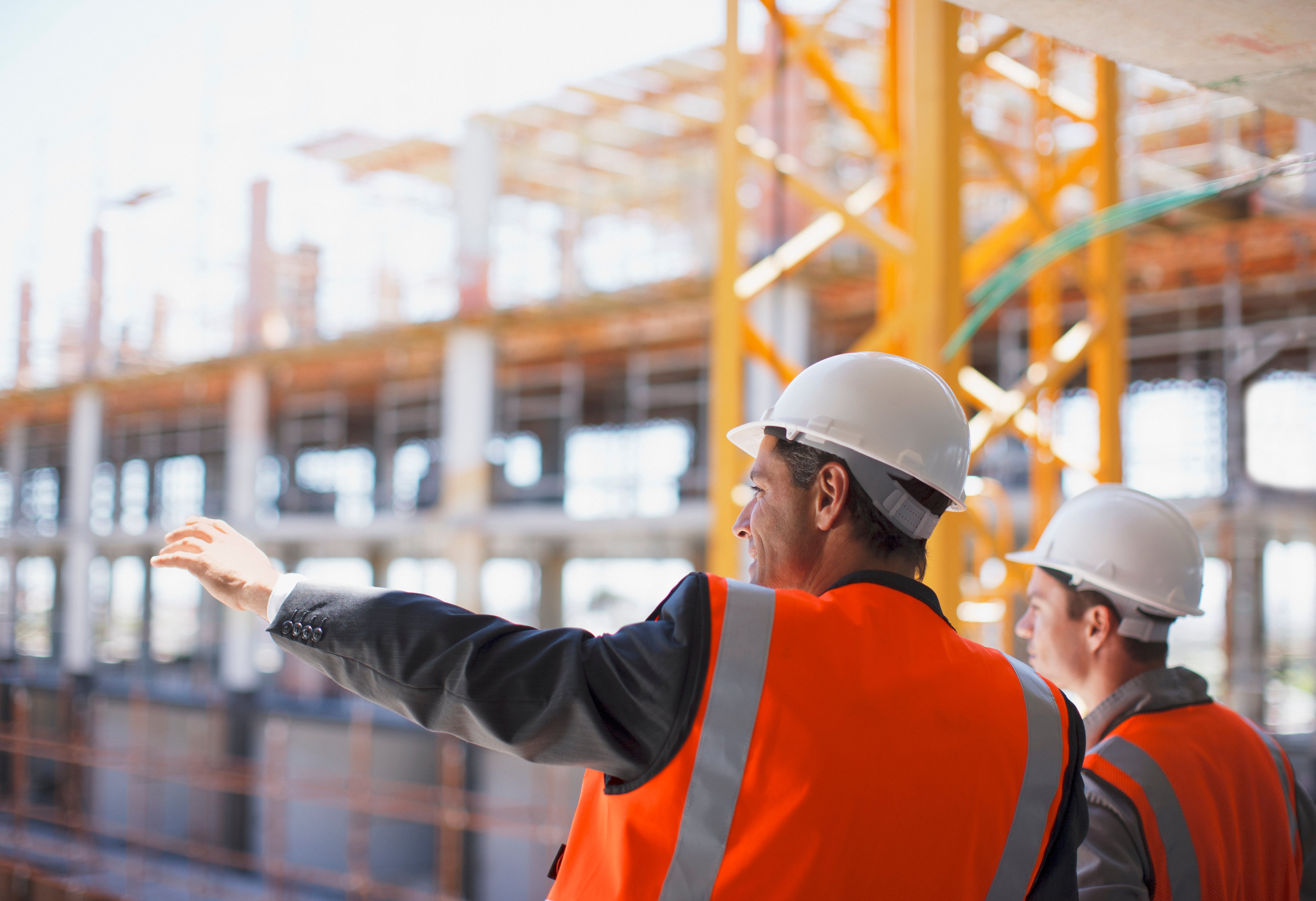 Canva---Construction-workers-working-on-construction-site